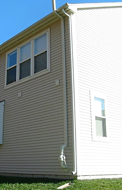 Reference photograph of an exterior radon system on a Connecticut house